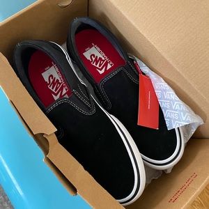 Black & White Vans Slip On Sneakers